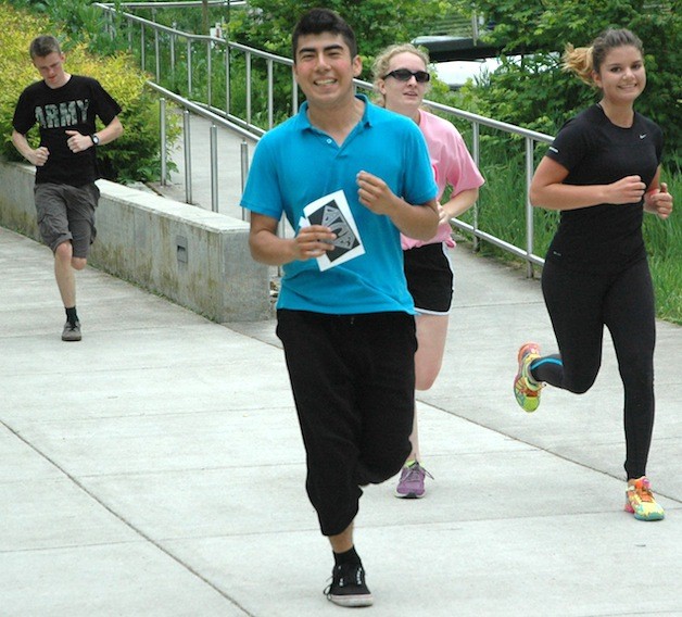 Marysville Getchell High School students are all smiles as they make their way across campus as part of this year's 'Amazing Race' on May 22.