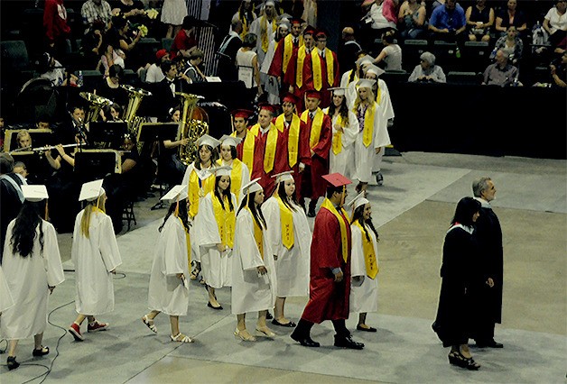 Members of the Marysville-Pilchuck High School Class of 2015 march into Xfinity Center in Everett at the start of their graduation ceremony June 10.