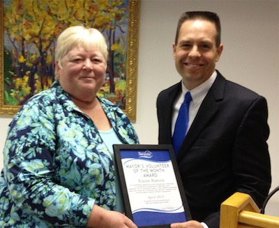 Elaine Hanson receives her Volunteer of the Month plaque from Mayor Jon Nehring at the May 13 Marysville City Council meeting.