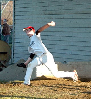 Sophomore Jake Thomas throws some pitches as practice draws to a close.