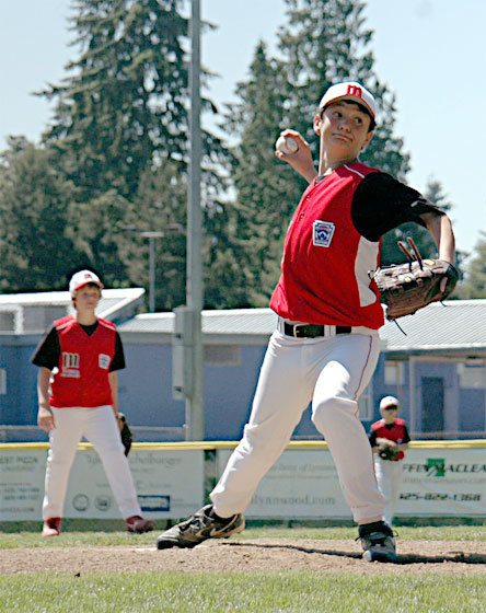 As second baseman Brayden Hopstad looks on