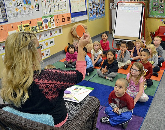 Teacher Shelley Koellmer teaches her preschool class about the circle shape. The early childhood program helps kids in need catch up and even surpass their peers by kindergarten.