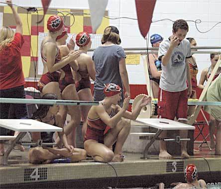 Junior Jewel LeValley looks up from the pool as she swims the anchor leg of the Tomahawks’ school record-setting 400 freestyle relay. Teammate Hannah Taylor