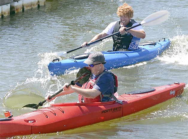 Marysville City Councilman Jeff Vaughan holds off a challenge to finish second in the kayak portion of the triathlon.