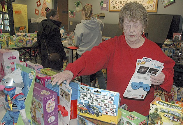 Verna Miles organizes toys at the Arlington Boys and Girls Club.