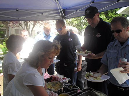 Merrill Gardens food service managers served burgers to Marysville Fire District Fire Marshal Tom Maloney
