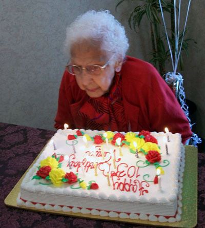 Virga Nordby receives her 103rd birthday cake April 16 at the Marysville Care Center.