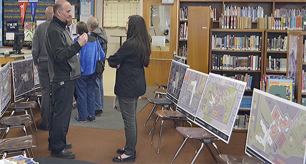 Facilities director Greg Dennis talks with voter Jeanna Petzoldt at the Open House at Marysville Middle School this week.