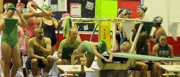 Marysville Getchell swimmers take off against Everett.