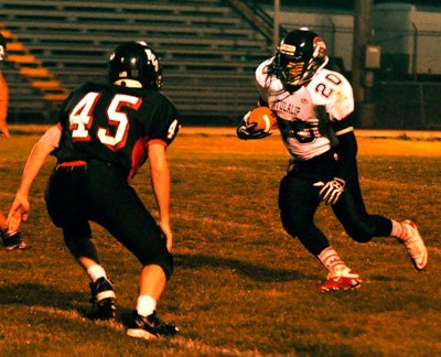 Hawks freshman s Comenote runs the ball against Highland Christian on Sept. 20. The game ended in an 88-22 victory for Tulalip Heritage.