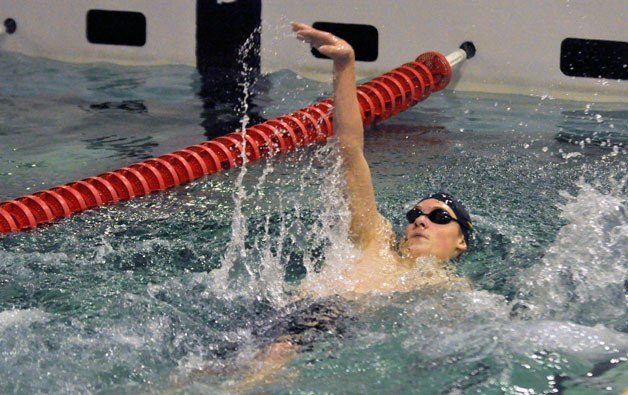 MG sophomore Thomas Lindgren performs the backstroke at the 3A District Preliminaries on Feb. 14.