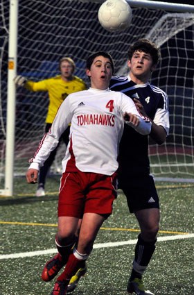 M-P’s Kevin Spiva fights for position with the ball in the air.