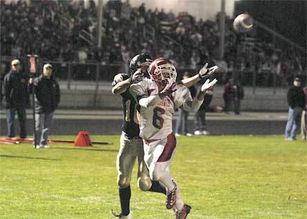 M-P senior running back Chris Larson looks in a throw during the second quarter of a 42-13 victory.