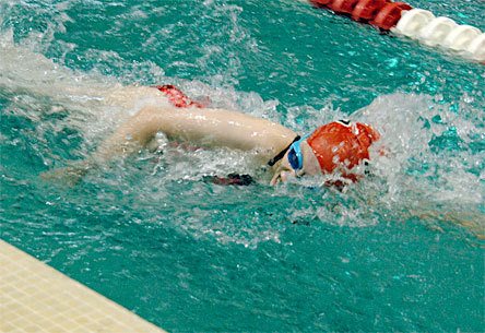 Sixteen-year-old Alicia Malavolti swims in the winning mixed 200 freestyle relay