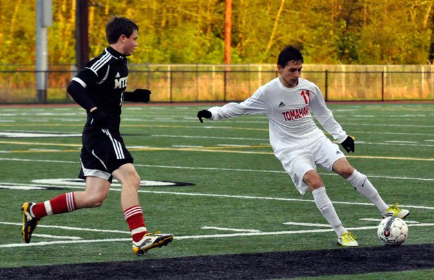 Sophomore mid Amador Israel takes possession of the ball during the Friday