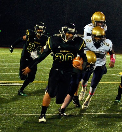Chargers’ running back Cullen Zackuse runs the ball against Oak Harbor on Oct. 12.
