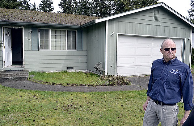 Marysville code enforcement officer Deryck McLeod checks out what he says was a former drug house that is now empty