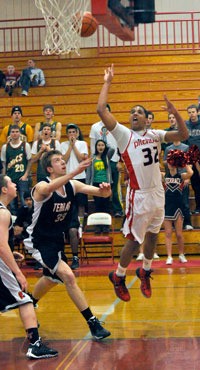 M-P senior pointguard Dante Fields jumps to sink a shot over a Mountlake Terrace defender on Jan. 28.