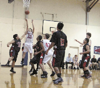 Highland Christian senior Jeff Kelly hits a shot for three early in the fourth quarter