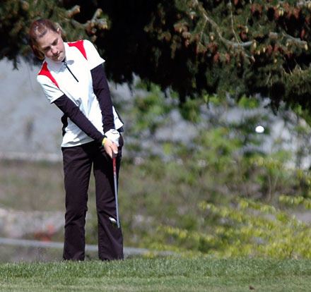 Abby Beachamp hits a chip shot onto the third green at Legion Memorial Golf Course.