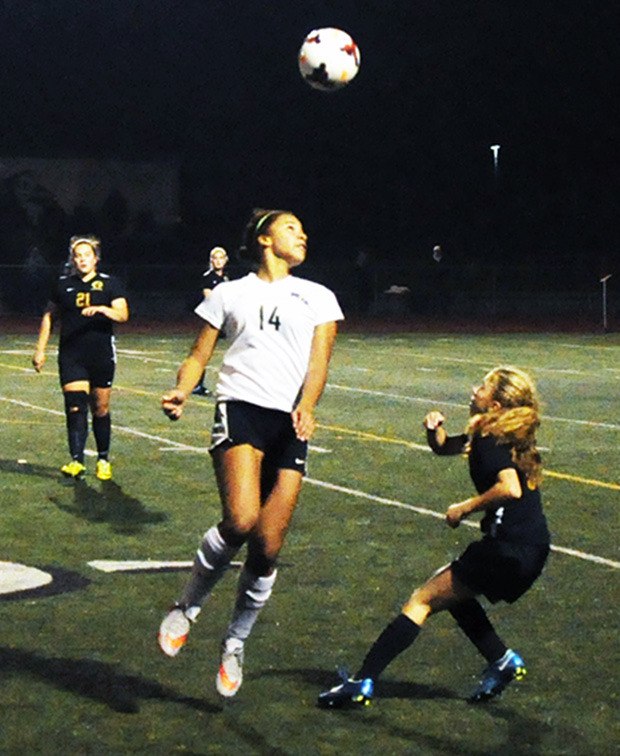 Oshinaye Taylor of Marysville Getchell heads the ball in game against Glacier Peak Oct. 21.