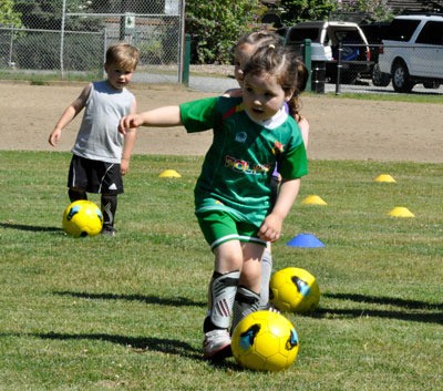 Children ages 3-4 practiced dribbling on the Jennings Park Ballfield during a class offered through Marysville Parks and Recreation and Kidz Love Soccer.
