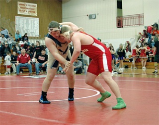 Tomahawk senior Ricky Dschaak and Arlington heavyweight Bryant Dickerson go way back
