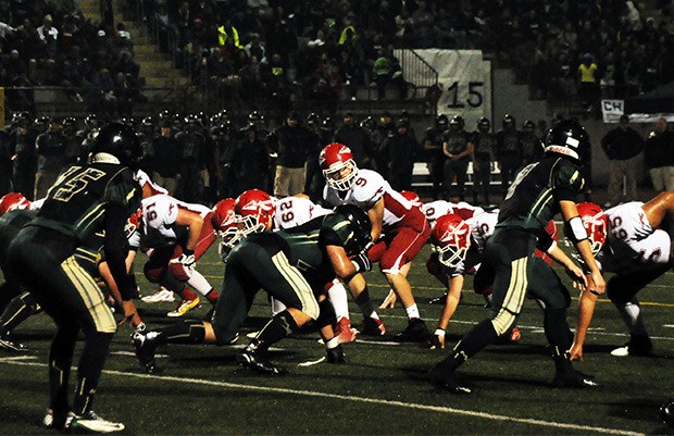 M-P's quarterback Eric Lind under center to take a snap.