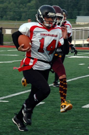 Marysville “Tomamama” Andie “Mrs. Locker” White moves like she has a purpose during her team’s Powder Puff match-up against the Lakewood “Cougar Mamas” on June 17.