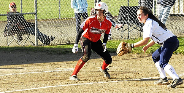 Marysville-Pilchuck's Abi Otto eyes home plate from third base during the Tomahawks' game against Arlington March 30.