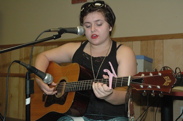 Cama Durbin supplies some folk-flavored acoustic music for the first Marysville Strawberry Jam open-mic night on Aug. 22.