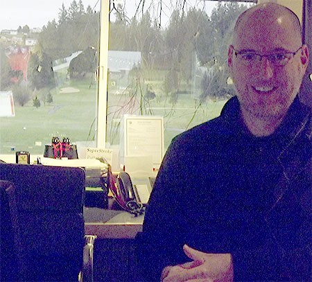 Mike Reynolds runs the Pro Shop at Cedarcrest Golf Course. He is shown here with Hole 10 in the background out the window. The course may be getting a new management team by March 1.