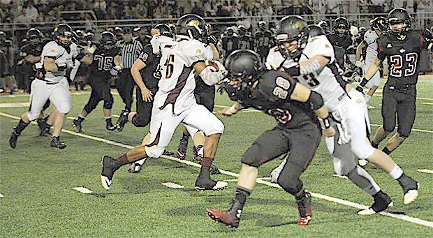 Josh Dickey takes off for a 70-yard touchdown after catching a swing pass is Lakewoods 50-20 win over Cedarcrest.