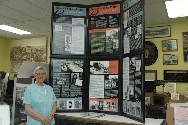 Ethel Cage shows off the exhibit from the Women's Legacy Project of Snohomish County that's being hosted by the Marysville Historical Society through the end of September.