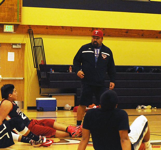 Tulalip assistant coach Cyrus Fryberg gives the Hawks a pep talk during practice as they enter the 2A state regional tournament.