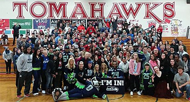 This Twitter photo shows Seahawk team members and the mascot visiting with some students at Marysville-Pilchuck High School Nov. 18.