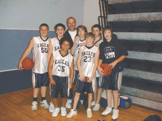 The seventh-grade Arlington AAU basketball team won the championship at Western Washington University MLK tournament. Pictured