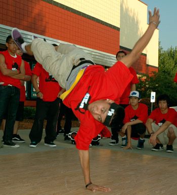Dom Dacoco pops a handstand at a breakdancing demonstration Aug. 6 at the Marysville Regal Cinemas for the Marysville YMCA's upcoming 360 B-Boy