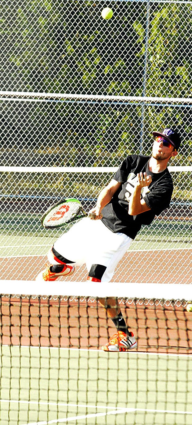 Marysville Getchell senior Austin Groves hits a serve in a doubles match against Lynnwood Sept. 15.