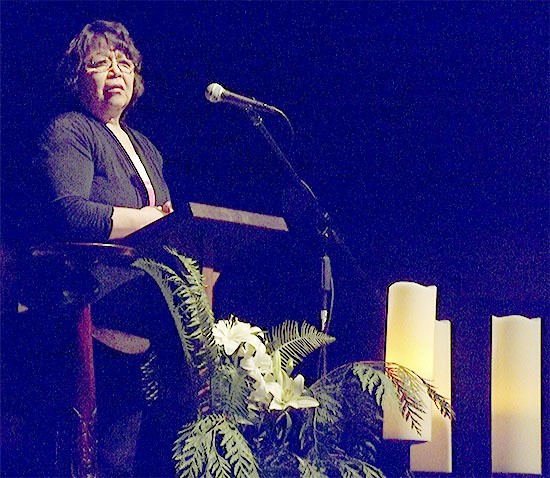 Marie Zackuse of the Tulalip Tribes Board of Directors gives the closing prayer at the Interfaith Candlelight Prayer Service at the Marysville-Pilchuck High School auditorium Feb. 24.