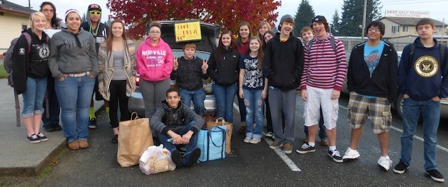 The students of Marysville Mountain View High School show off their haul for the Marysville Community Food Bank in November.