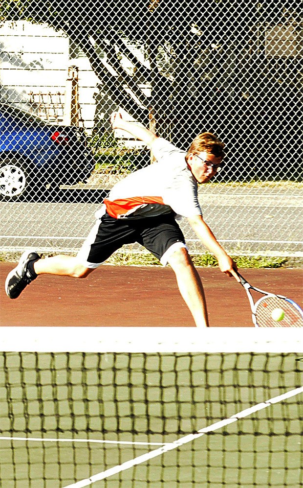 Marysville-Pilchuck's Logan Plant keeps volley alive in a singles match against Meadowdale Sept. 15.