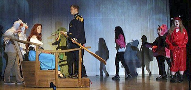 The famous scene for the song 'Kiss the Girl' is part of the play being put on at M-PHS.