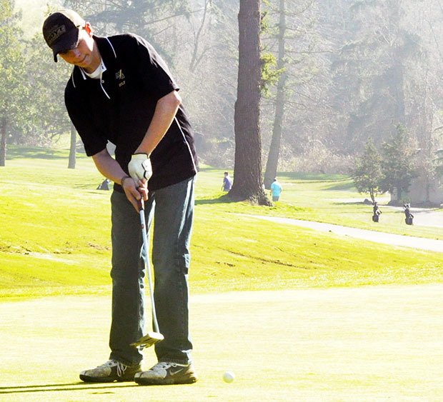 A Marysville Getchell golfer practices his technique.