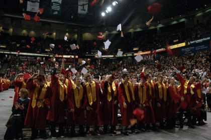 The nearly 600 graduating seniors of the Marysville-Pilchuck High School Class of 2010 toss their caps in the air after turning their tassels in the Everett Events Center June 15.