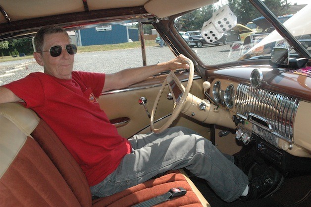 Marysville's Carol Tutmark relaxes in his 1952 Chevrolet Bel Air at the Faith Lutheran Church of Lakewood's Hot August Car Show on Aug. 10.