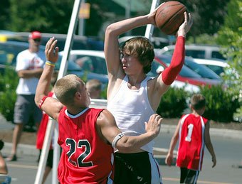 Ryan Shannon scans the court for an open teammate during last year’s 3-on-3 X-travaganza.
