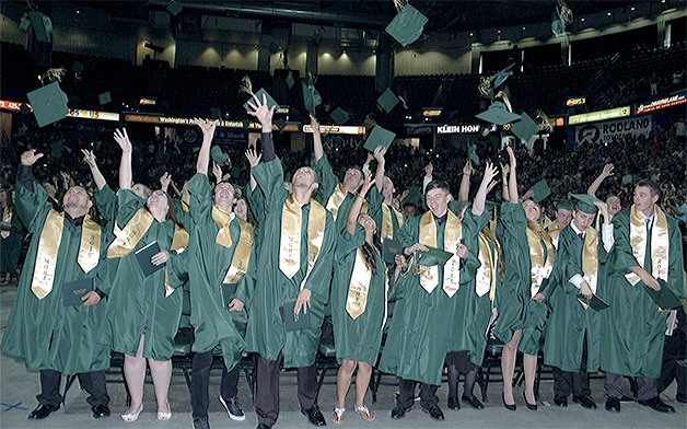 The Marysville Getchell High School graduating Class of 2015 celebrates at the end of the ceremony at Xfinity Arena in Everett June 10.