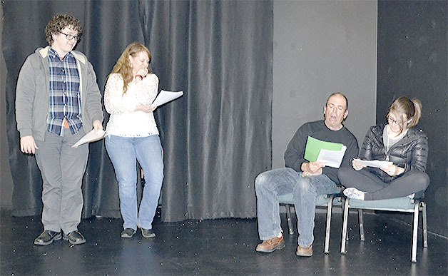 Joren and Johnna Thiessen have a hard time holding back their giggles as director Brian Kesler stands in for one of the kids in the play 'Easter Scrooged.' At right is Rebecca Thiessen