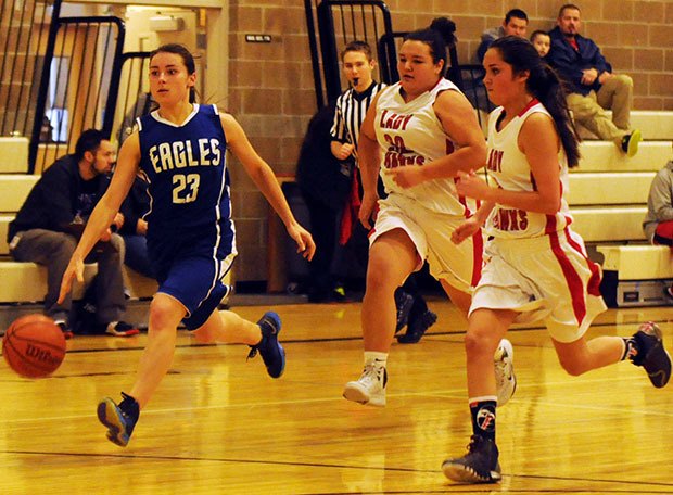 Grace's Naomi Tuttle dribbles the ball past Tulalip defenders.